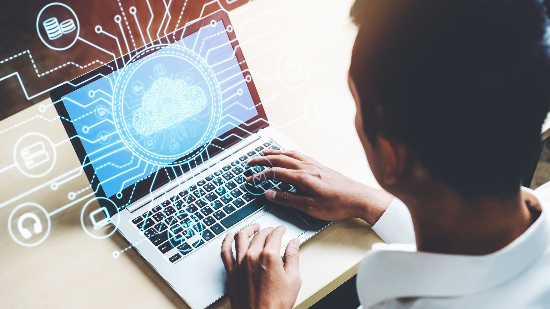 Une personne utilisant un ordinateur portable, entourée d'éléments graphiques représentant le cloud computing, la cybersécurité et les données numériques, illustrant les thèmes de la technologie et du RGPD.